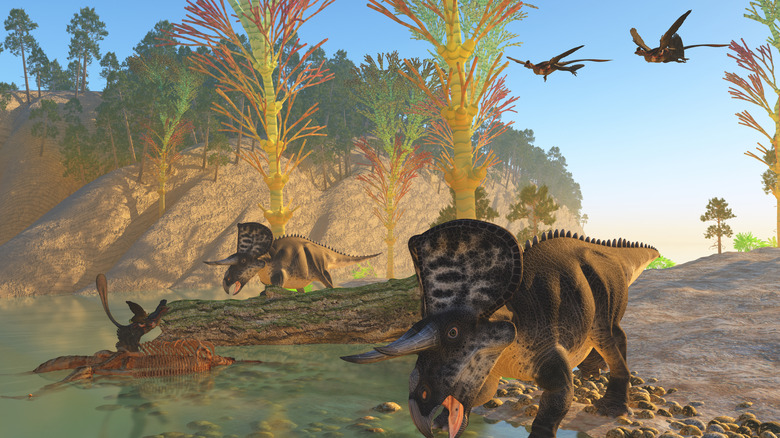Prehistoric scene various dinosaurs near a tree-lined river