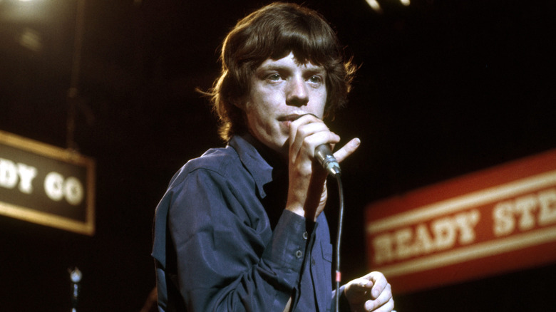 Mick Jagger singing into microphone in the late 1960s