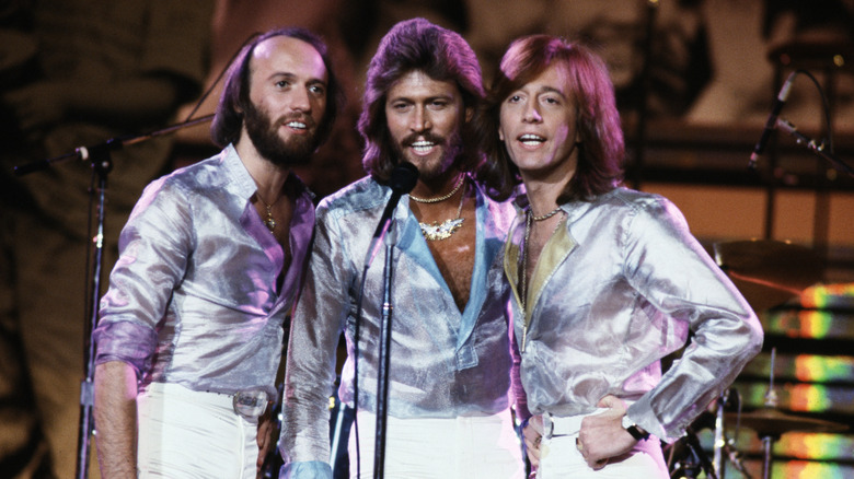 The Bee Gees singing together on stage