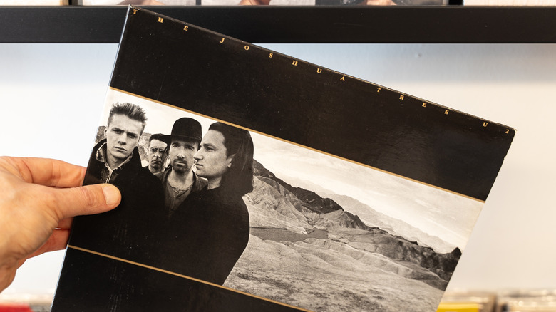 Customer holding The Joshua Tree record