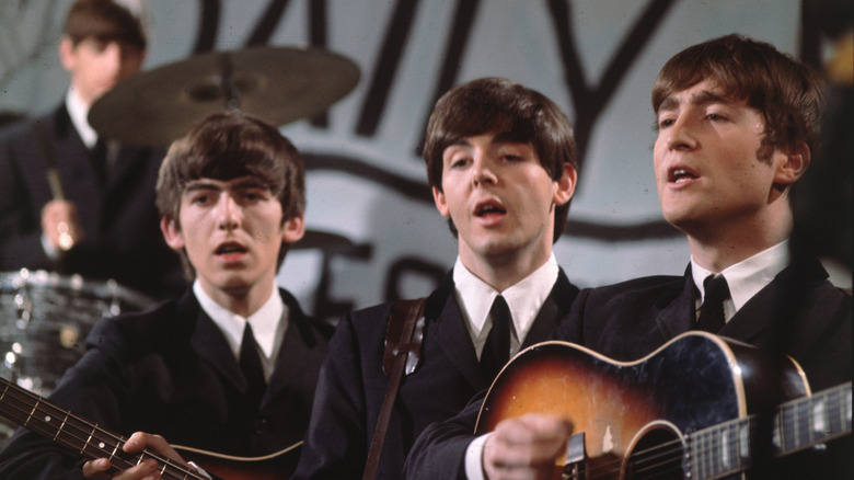 The Beatles performing together on a TV show