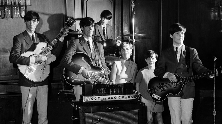 The Cowsills posing with instruments