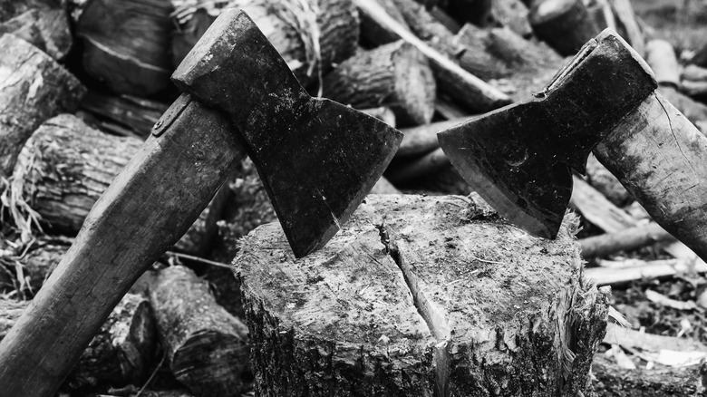 hatchets in a log