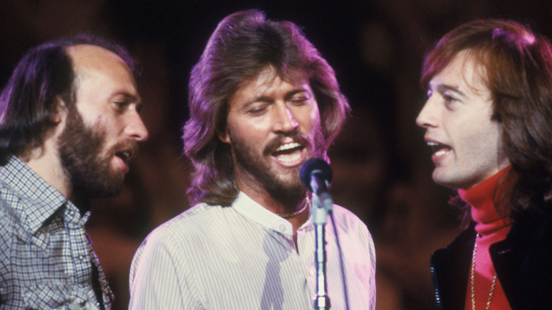 Bee Gees singing on stage