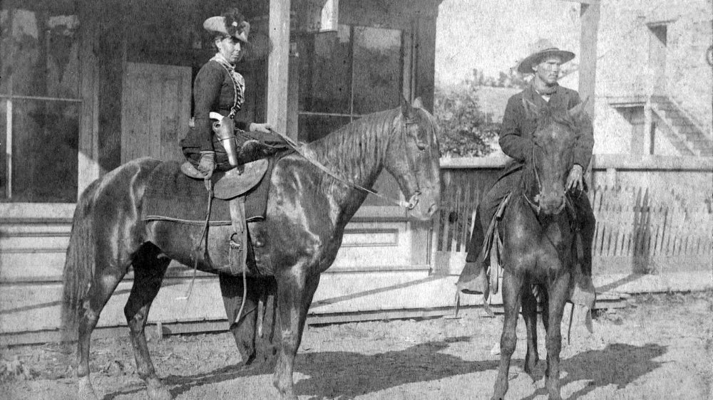 Belle Starr, sitting side saddle on her horse, 1886