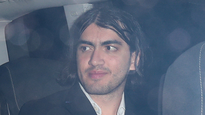 Bigi Jackson smirking in a car