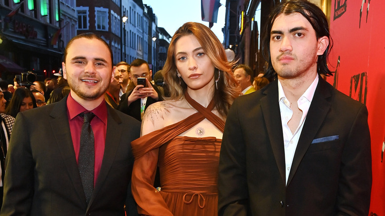 Prince, Paris, and Bigi Jackson in formal clothes on red carpet
