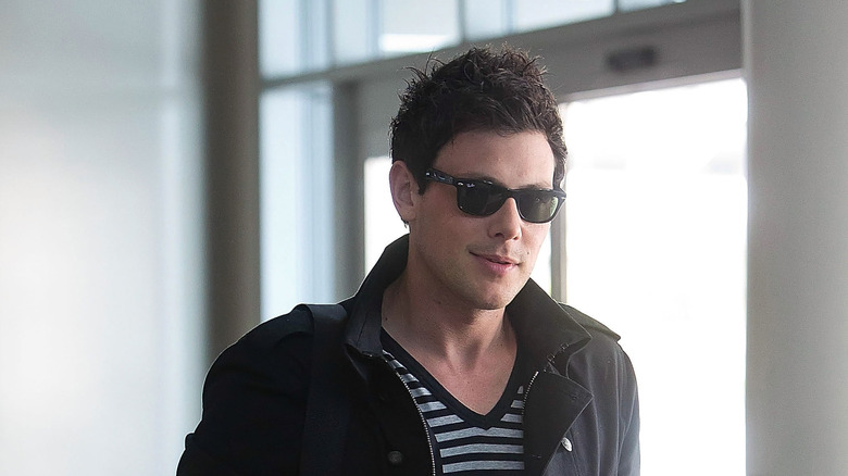 Cory Monteith in front of a Fox banner