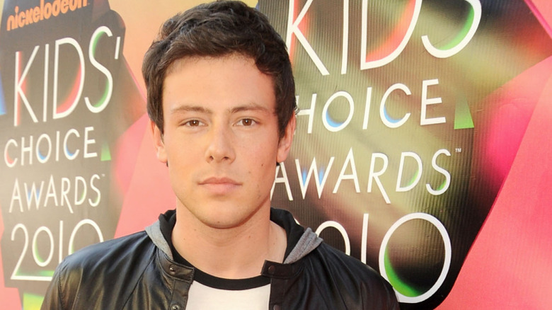 Cory Monteith in front of Nickelodeon Kids' Choice Awards background