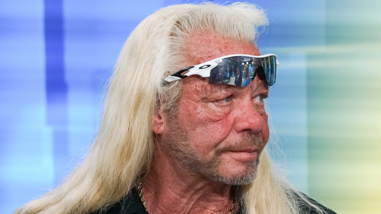duane chapman with sunglasses propped on forehead