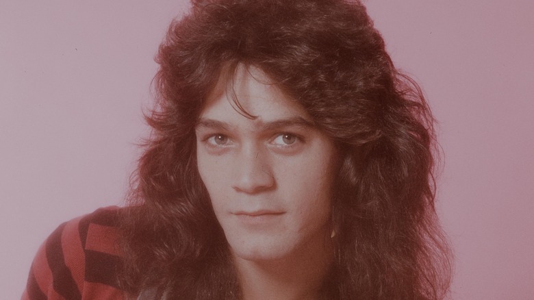 eddie van halen staring into camera pink background