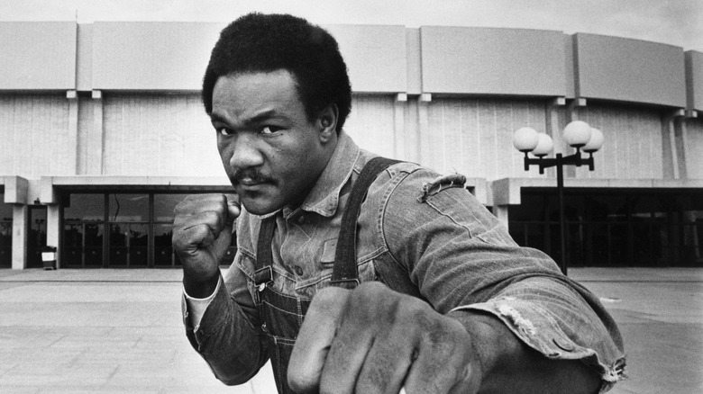 George Foreman posing in a boxing stance in 1976