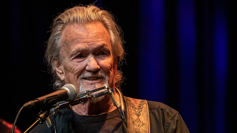 Kris Kristofferson performing microphone