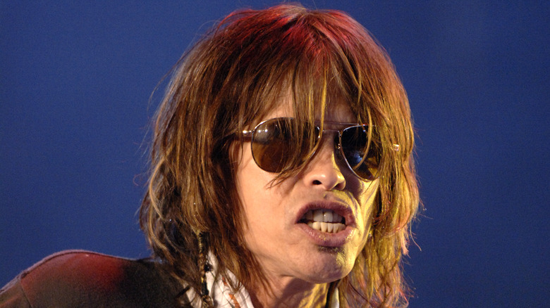 Steven Tyler wearing sunglasses onstage in 2006