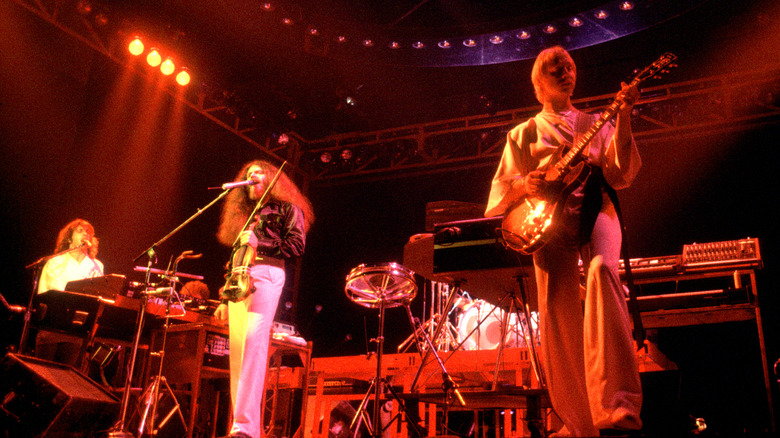 Kansas plays live on red-lit stage in the 1970s