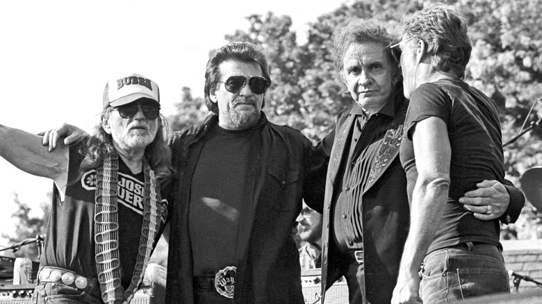 the highwaymen on stage on black and white photo
