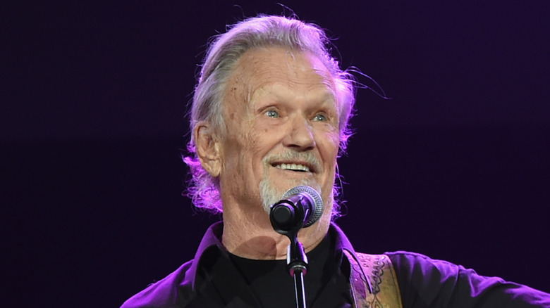 Kris Kristofferson smiling at microphone
