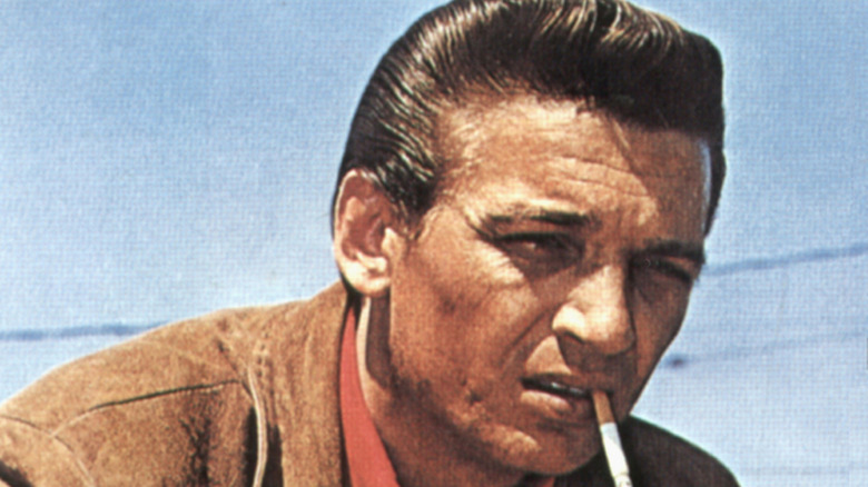 Waylon Jennings young with a cigarette on lips