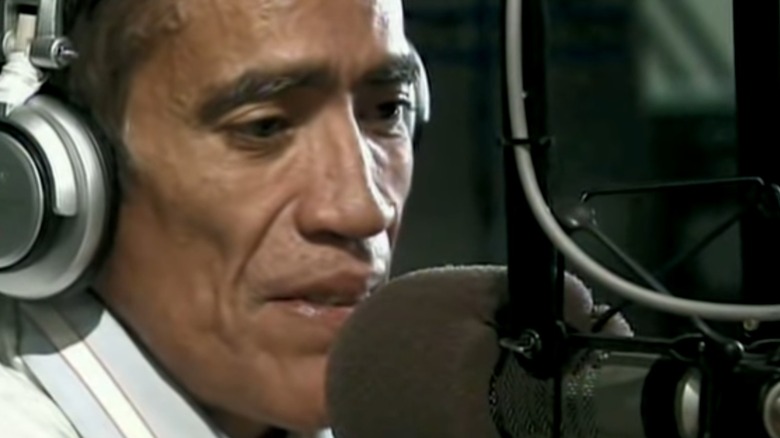 williams speaking into microphone