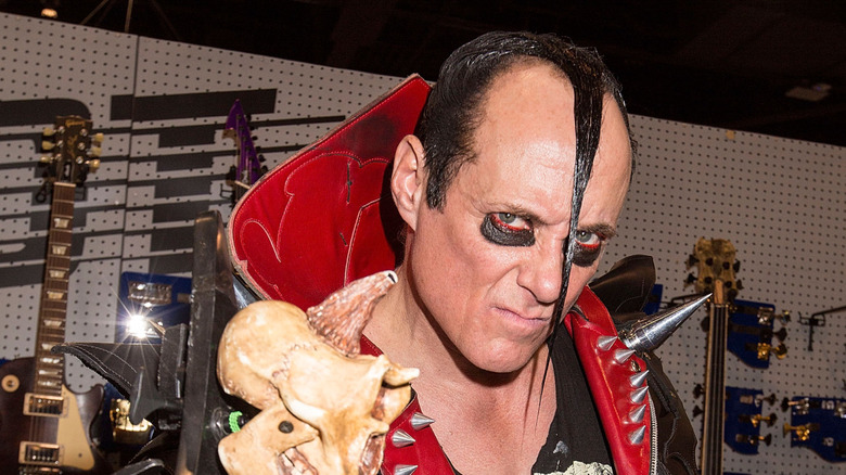 The Misfits' Jerry Only holding up his bass and posing for a photo in 2016