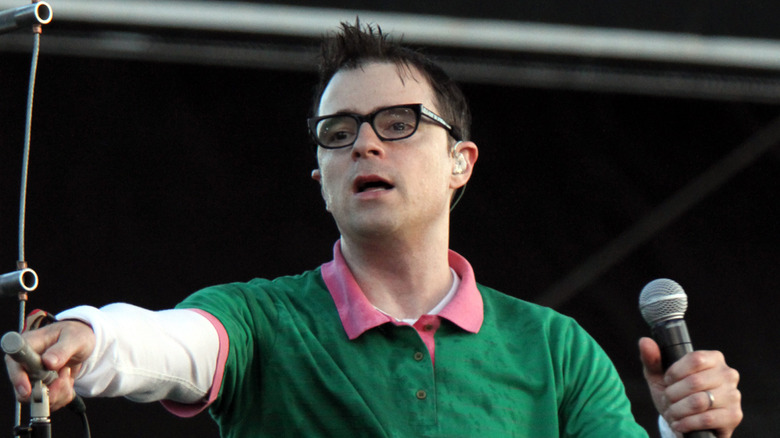 Rivers Cuomo on stage sweating with mouth open