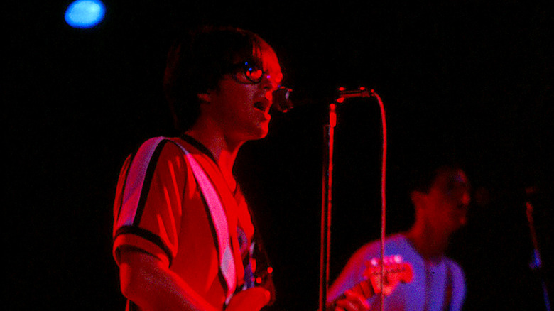 Jason Cropper playing behind Matt Sharp at Weezer show