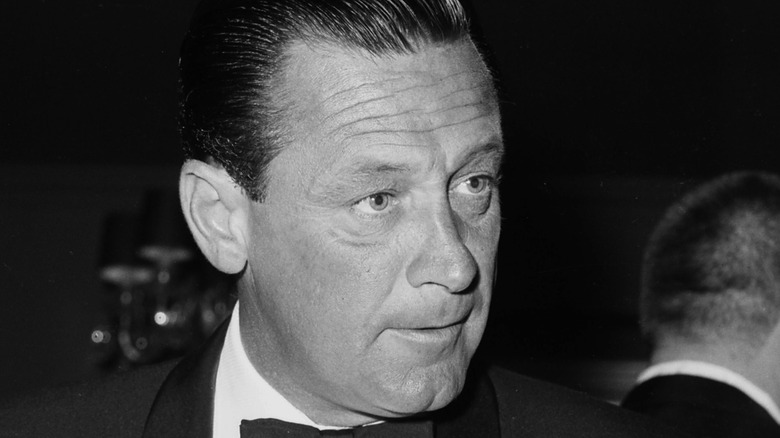actor William Holden wearing a bowtie