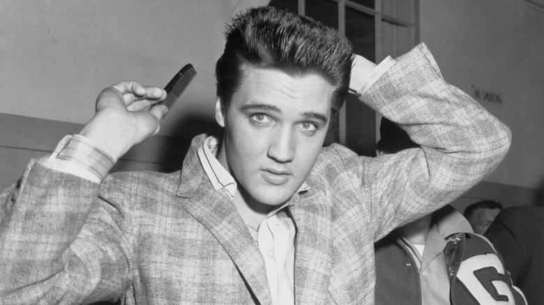 Elvis combing hair