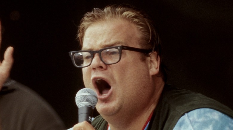 Chris Farley talking into a mic 