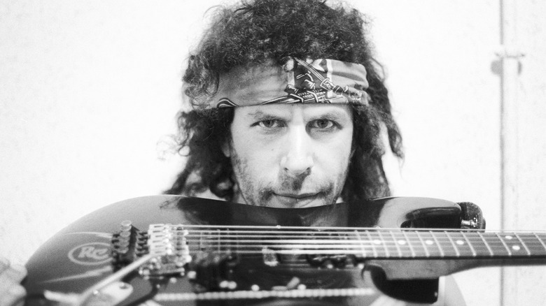 Randy California holding guitar