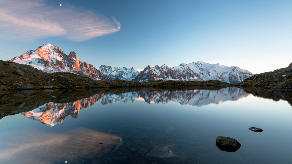 blue lake by mountains