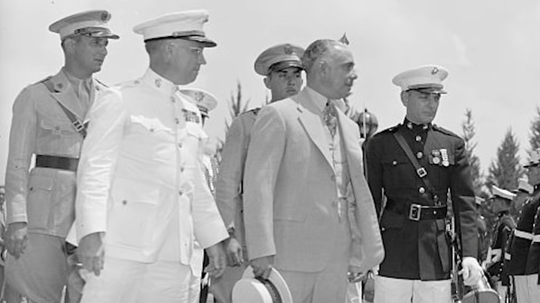 Dominican dictator Rafael Trujillo (center with his hat in hand) with his military officers