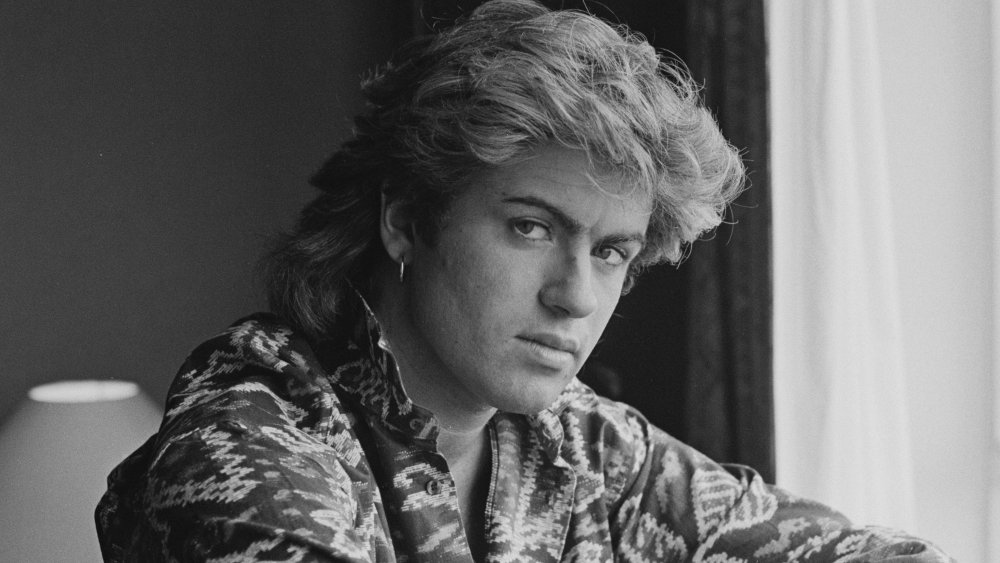 A profile shot of a young George Michael