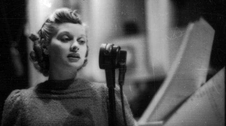 Lucille Ball in front of a microphone