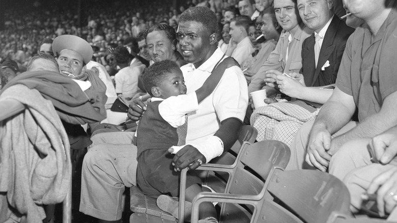 Jackie Robinson healing hand, with his son in the stands