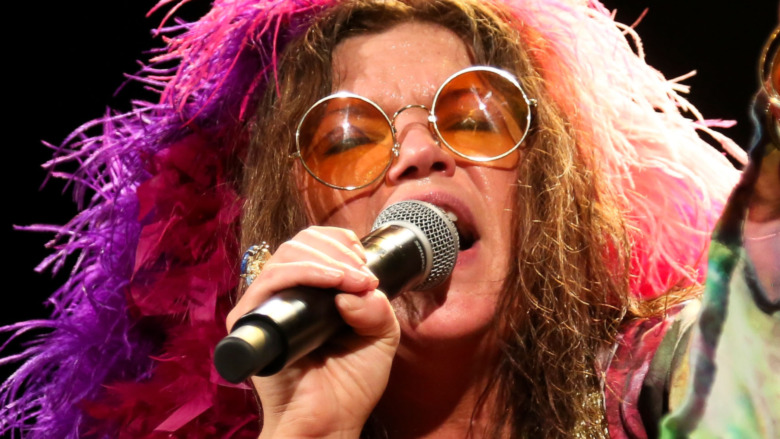 Janis Joplin singing on stage