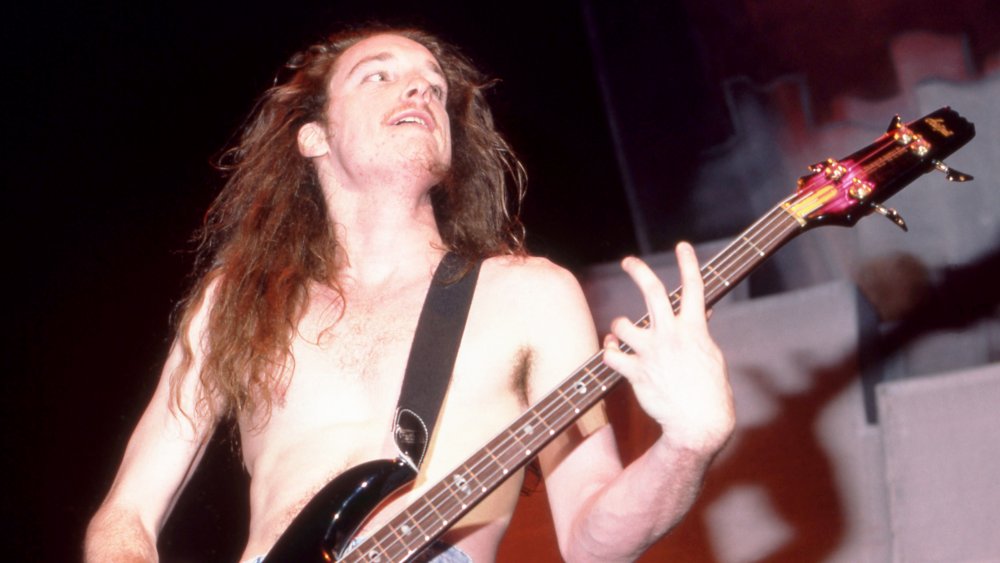 Metallica bassist Cluff Burton jams on the bass during a show