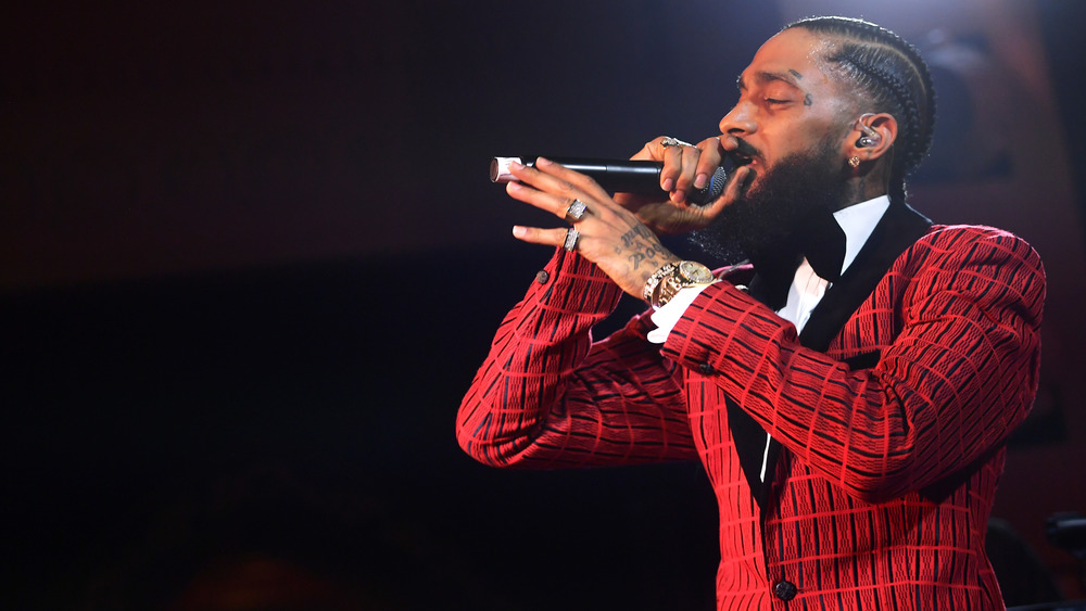 Nipsey Hussle performs on stage