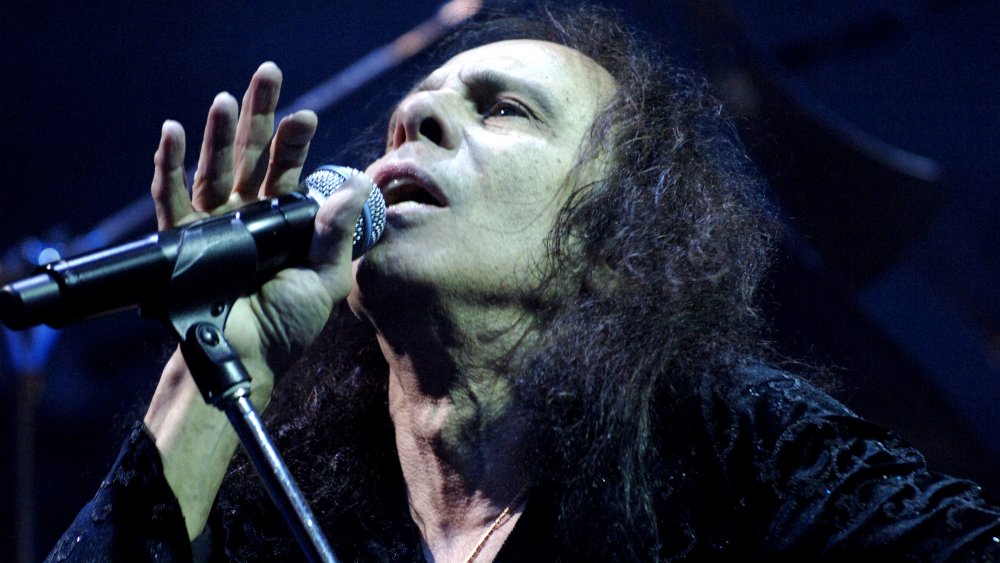 Ronnie James Dio performs in front of a crowd.