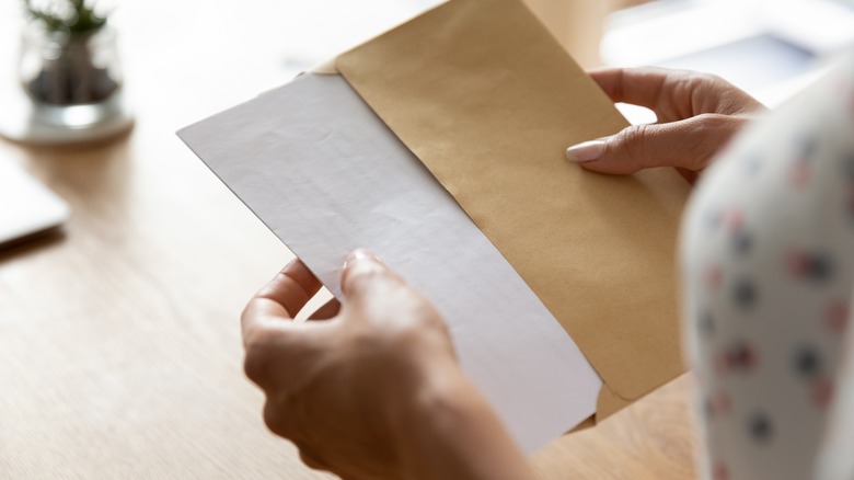 hands holding letter