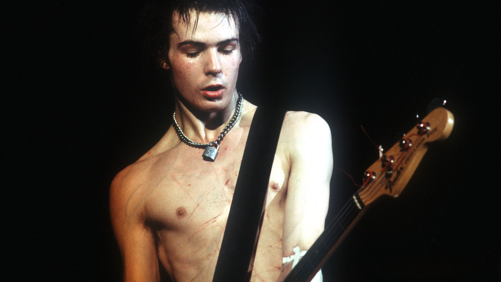 Sid Vicious playing guitar