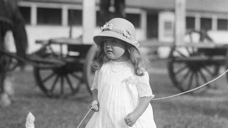 Barbara Hutton age 3 with dog