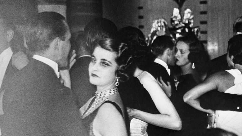 Barbara Hutton dancing at a party looking unhappy