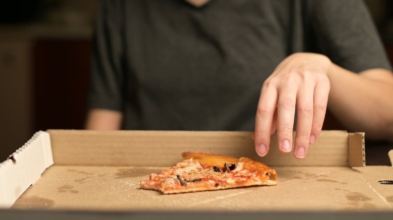 Eating from a pizza box