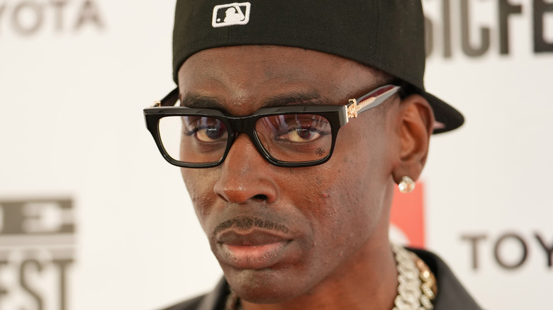 Young Dolph wearing glasses