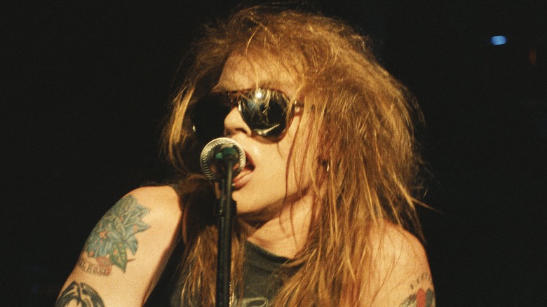 Axl Rose singing sunglasses tattoos