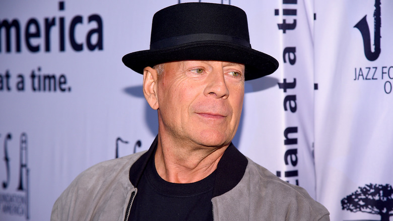 Bruce Willis wearing a hat at an event
