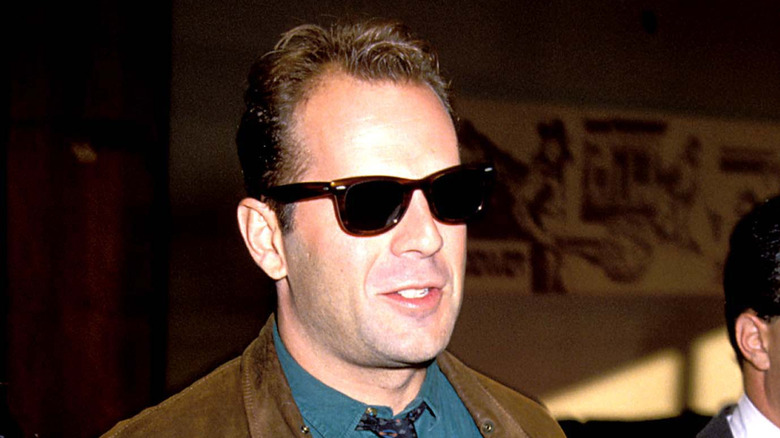 Bruce Willis with hair wearing sunglasses