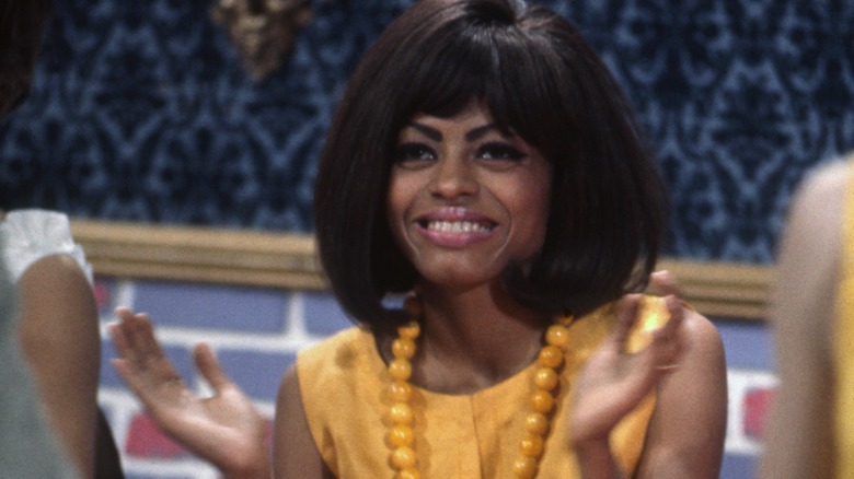 Diana Ross sitting table 1960s yellow top