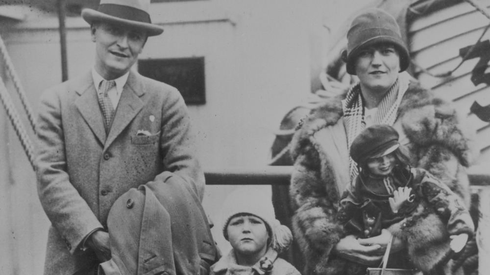 F. Scott and Zelda Fitzgerald, standing with daughter Scottie